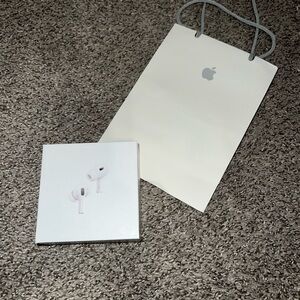 Apple AirPods Pro (2nd Generation) with white Apple gift bag